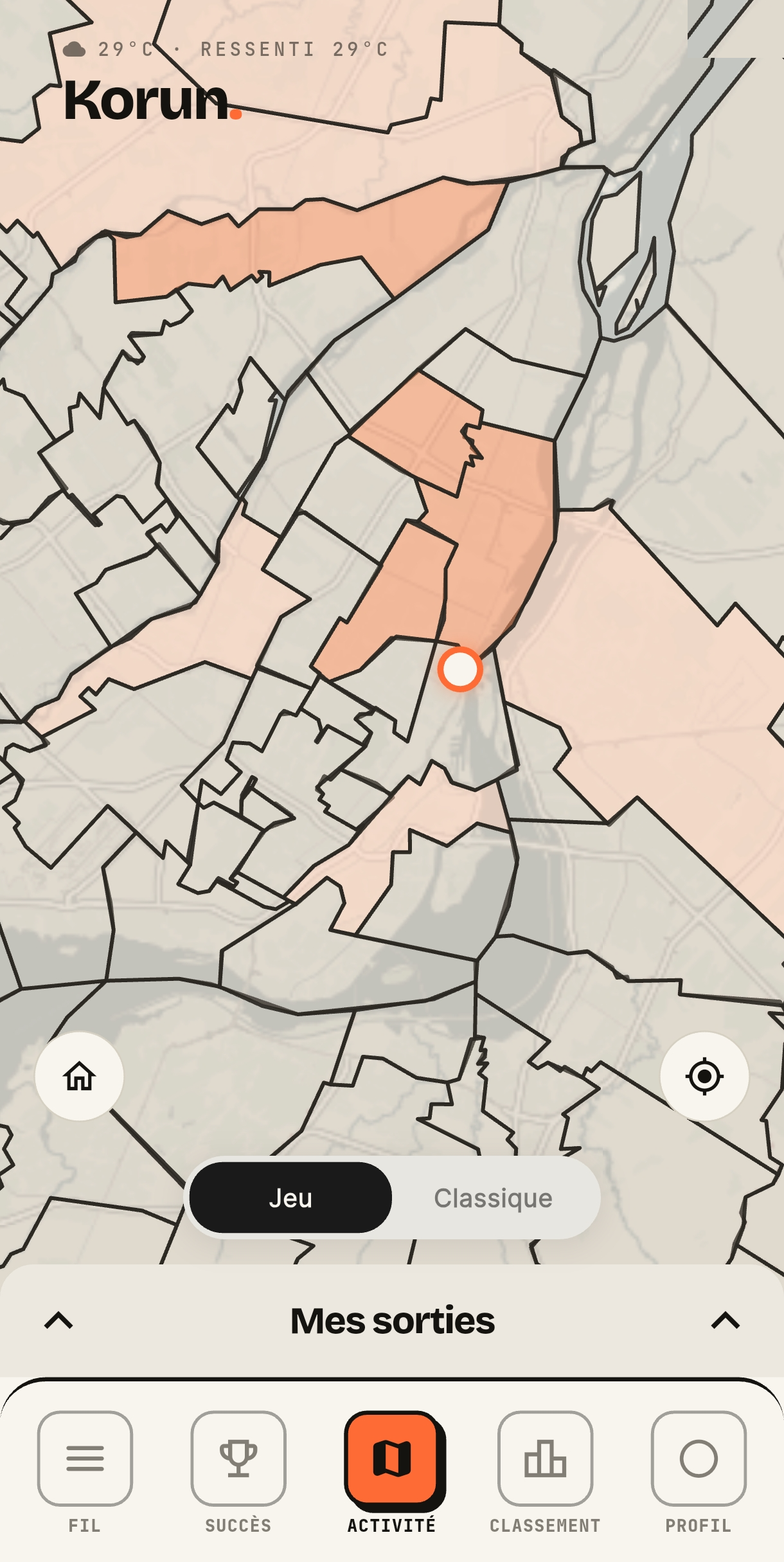 Écran carte de l'application Korun : la carte de Montréal en mode Jeu, les quartiers déjà conquis teintés d'orange, la position du coureur et le sélecteur Jeu / Classique.